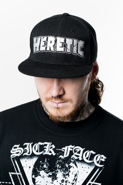 Snapback with HERETIC written on front.